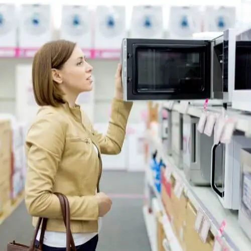 image of woman shopping for a microwave