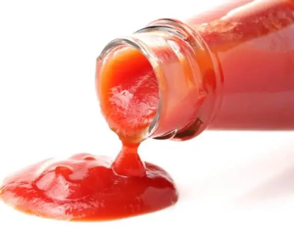ketchup coming out of a glass bottle
