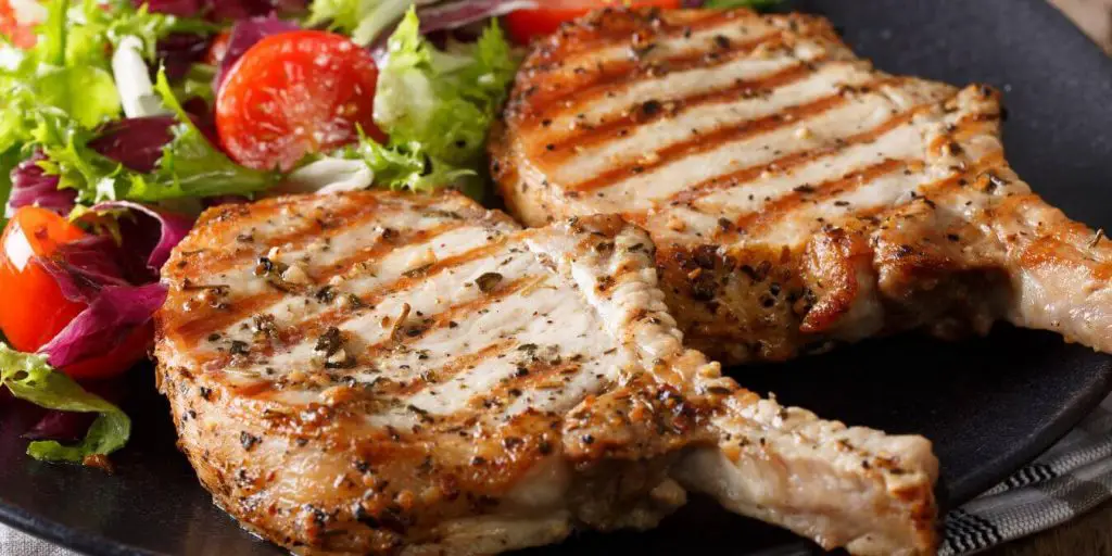 grilled pork chops with a fresh salad