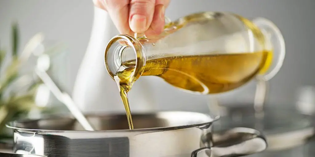 oil being poured while cooking