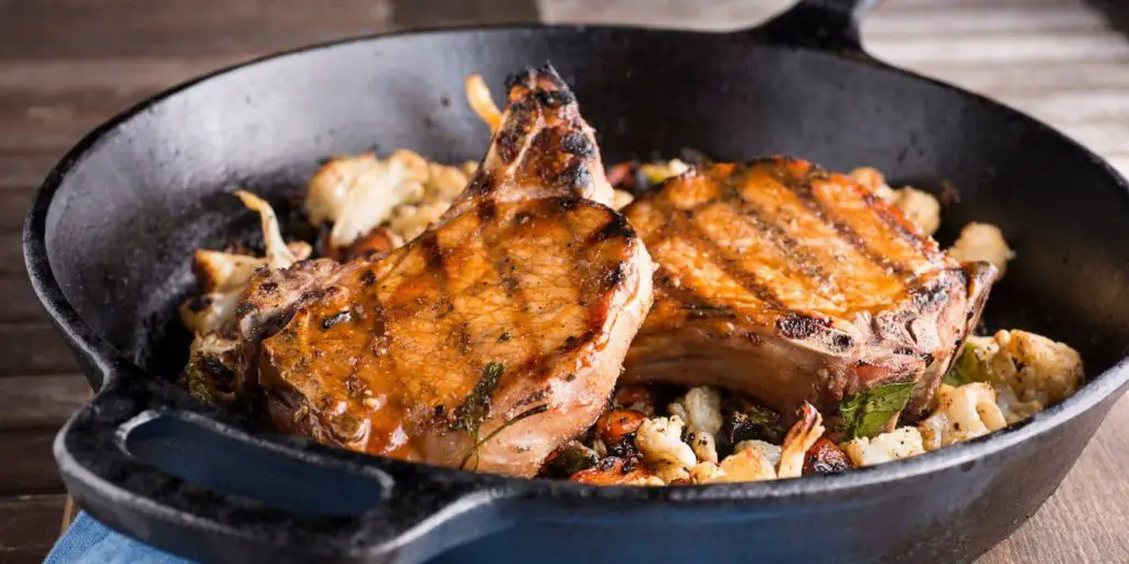 pork chops in a skillet. A delicious main dish to eat with cornbread.