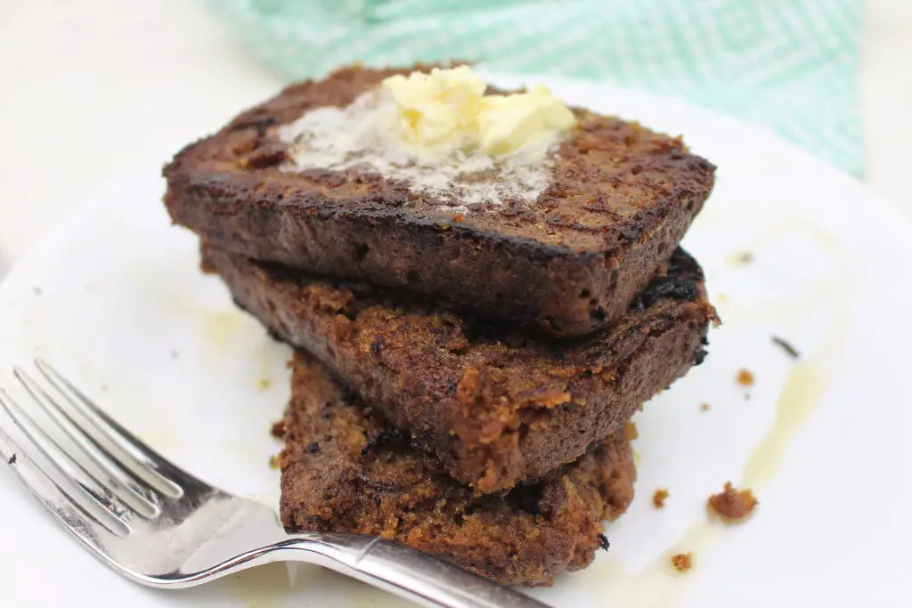 banana bread french toast plated and stacked with butter