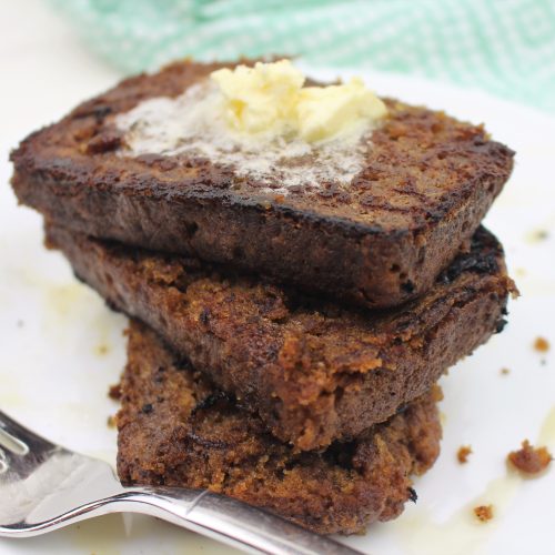 banana bread french toast plated and stacked with butter