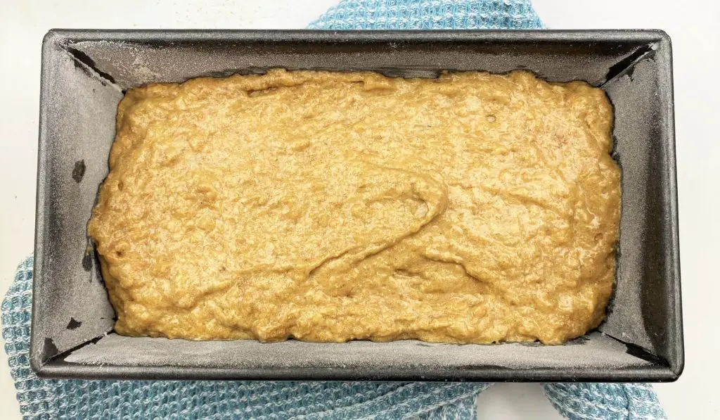 banana bread batter in prepared baking sheet