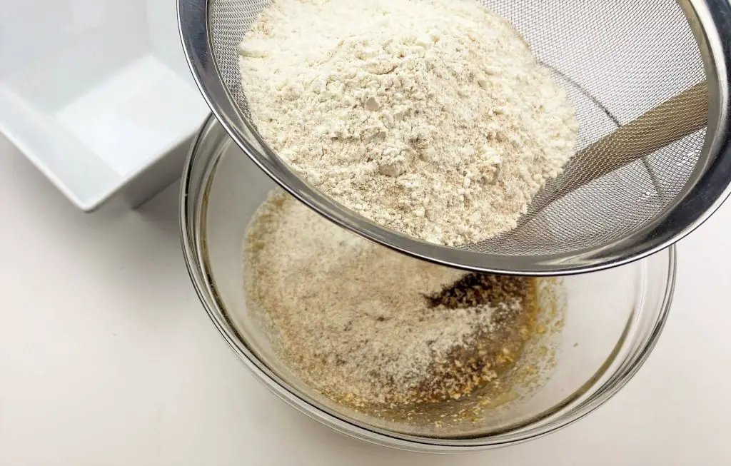 sifting in the dry ingredients for the banana bread