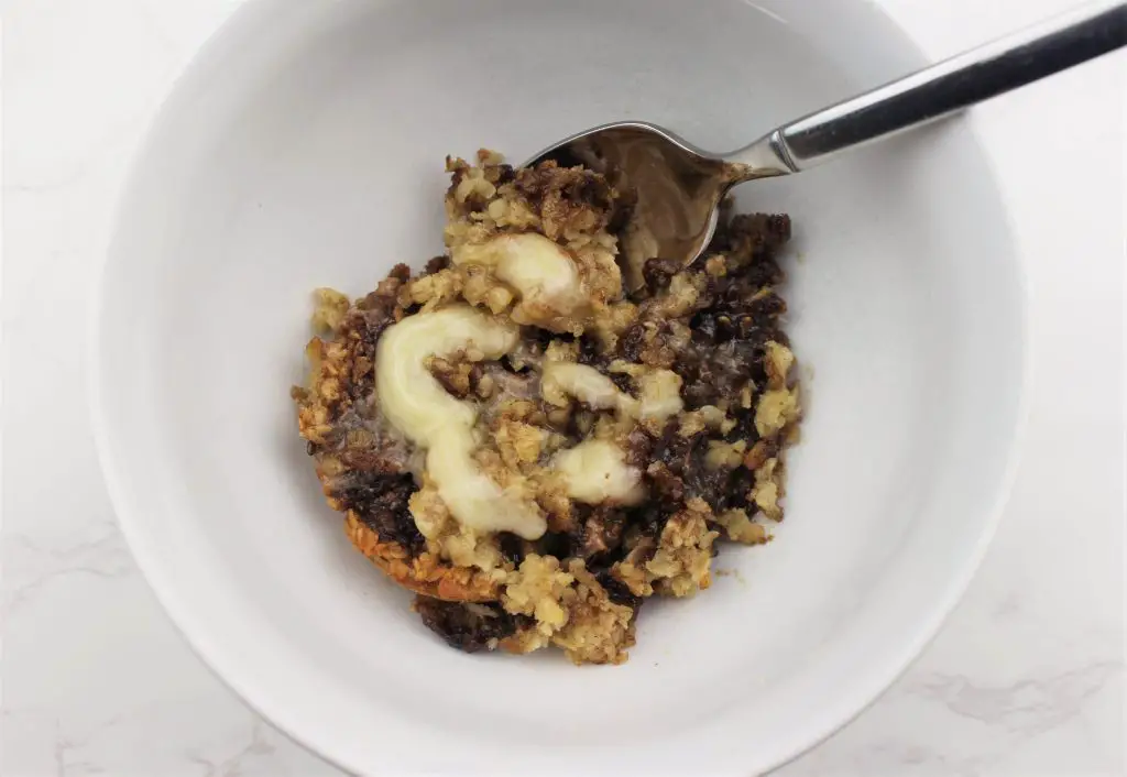 Cinnamon roll oatmeal in a bowl being served