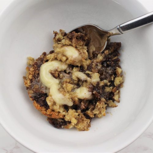 Cinnamon roll oatmeal in a bowl being served