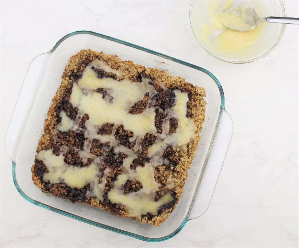 iced cinnamon roll oatmeal including bowl of extra icing