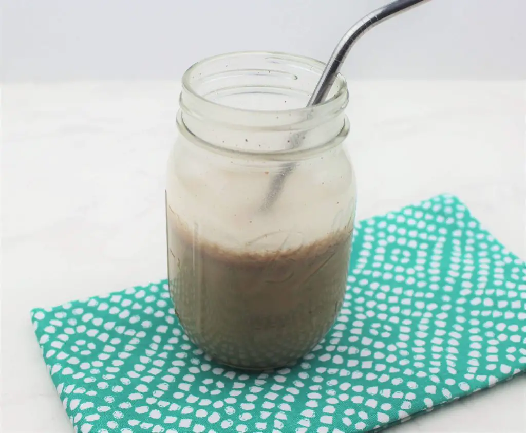 allergy friendly protein shake in ball jar on a green napkin.