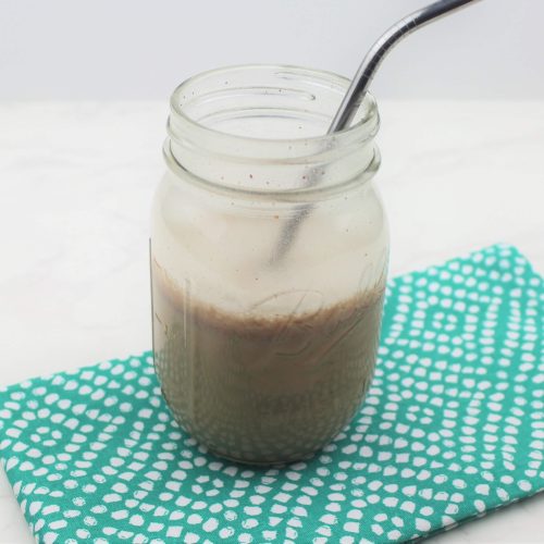 allergy friendly protein shake in ball jar on a green napkin.