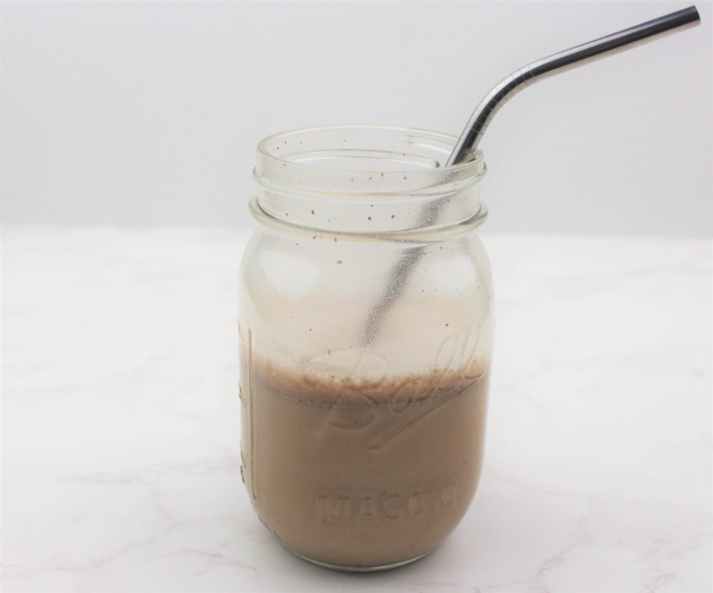 allergy friendly protein shake prepared in ball jar in front of white background